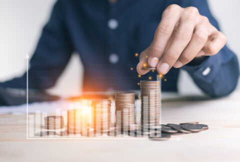 Businessman,Holding,Coins,Putting,In,Glass.,Concept,Saving,Money,For