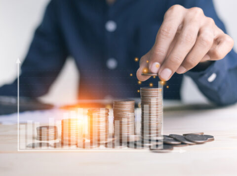 Businessman,Holding,Coins,Putting,In,Glass.,Concept,Saving,Money,For