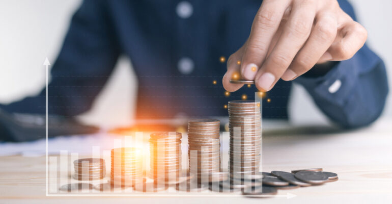 Businessman,Holding,Coins,Putting,In,Glass.,Concept,Saving,Money,For